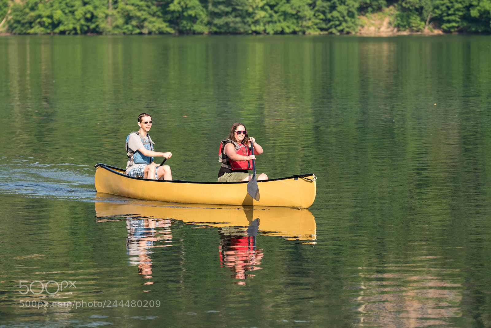 Sony a7R II sample photo. Couple paddling in yellow photography