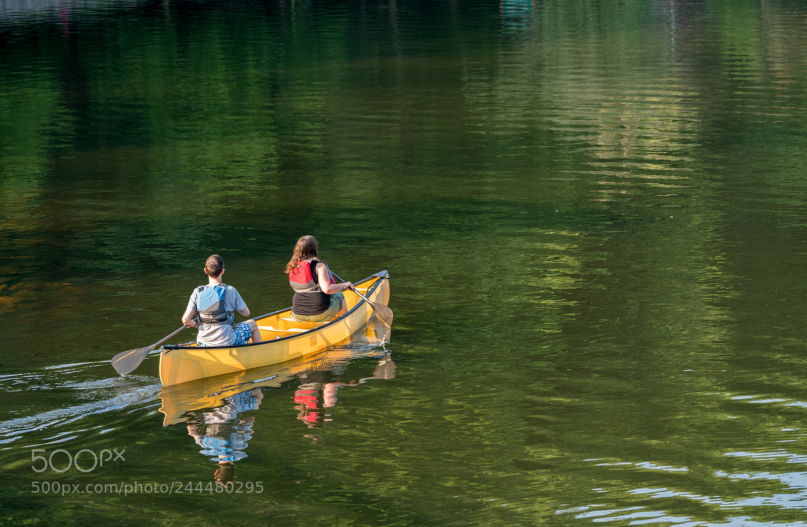 Sony a7R II sample photo. Couple paddling in yellow photography