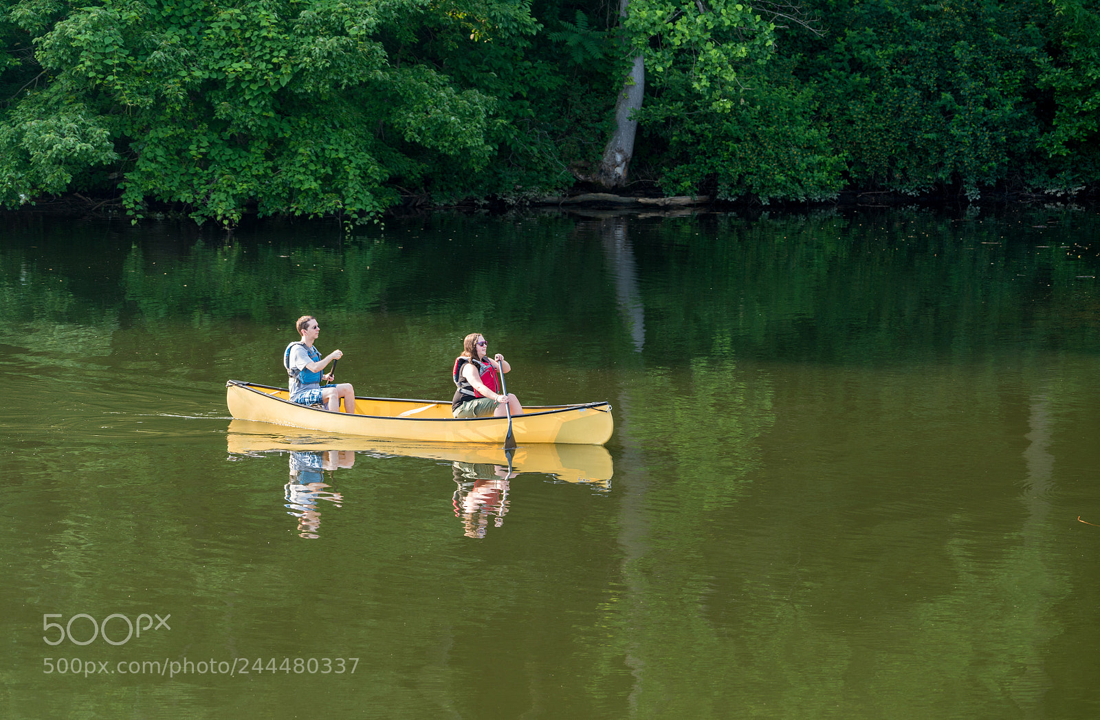 Sony a7R II sample photo. Couple paddling in yellow photography