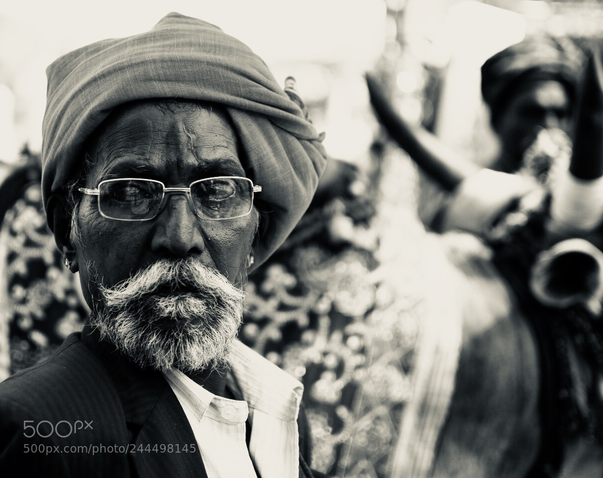 Nikon D7200 sample photo. Indian man walking with photography
