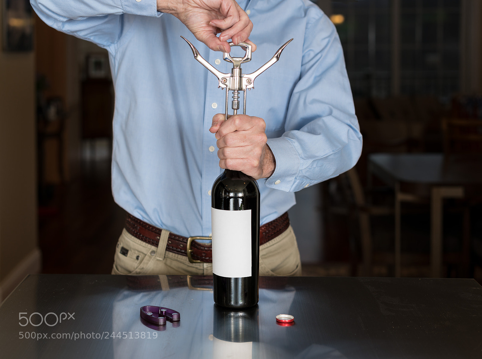 Sony a7R II sample photo. Senior man opening wine photography