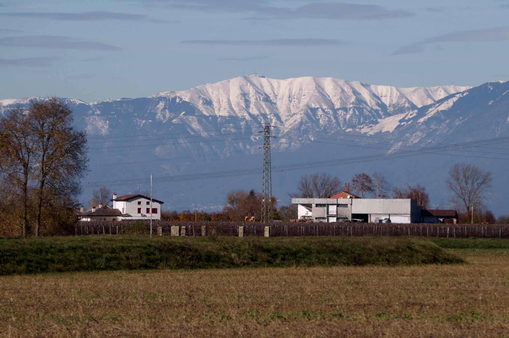 Sony E 55-210mm F4.5-6.3 OSS sample photo. Power lines with background photography