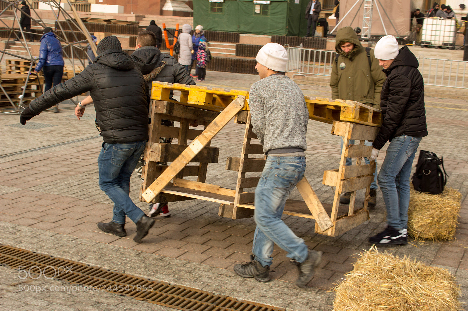 Canon EOS 100D (EOS Rebel SL1 / EOS Kiss X7) sample photo. Men carry a wooden photography
