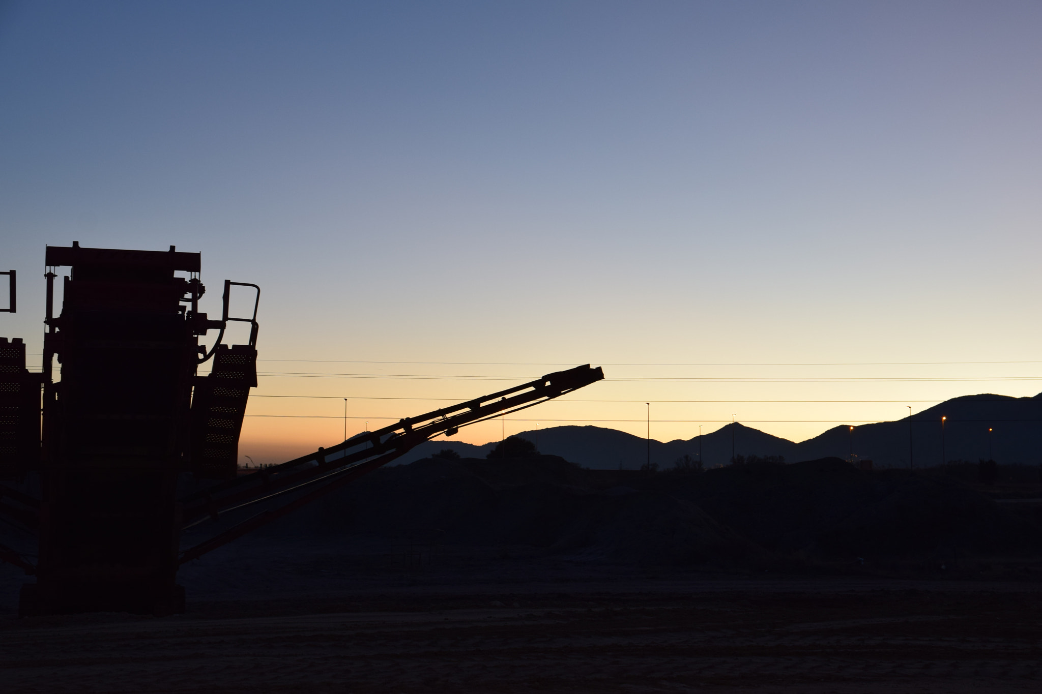Sigma 17-70mm F2.8-4 DC Macro OS HSM | C sample photo. Heavy machinery in white sunset photography