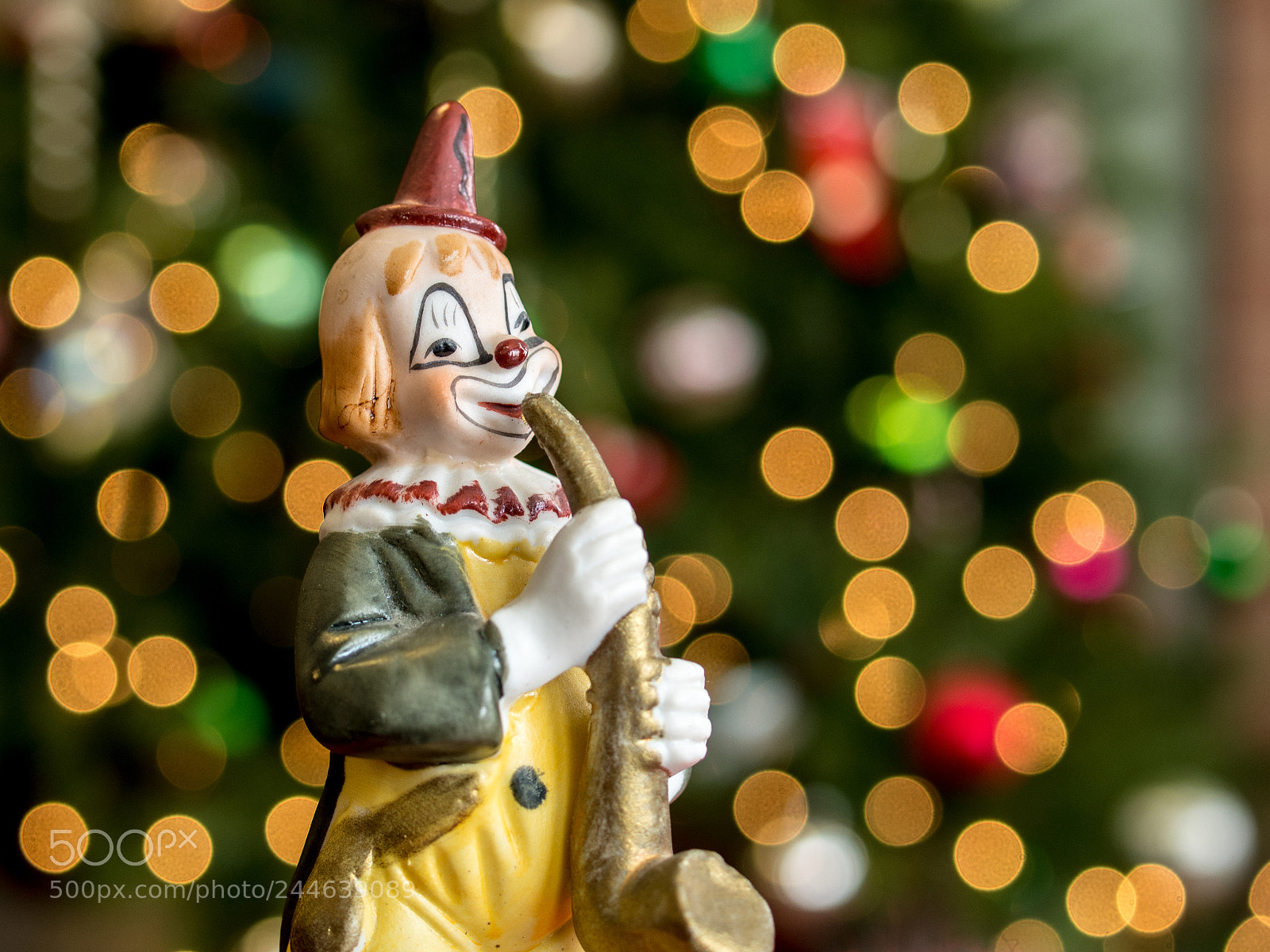 Olympus OM-D E-M5 sample photo. Clown saxaphone figurine photography