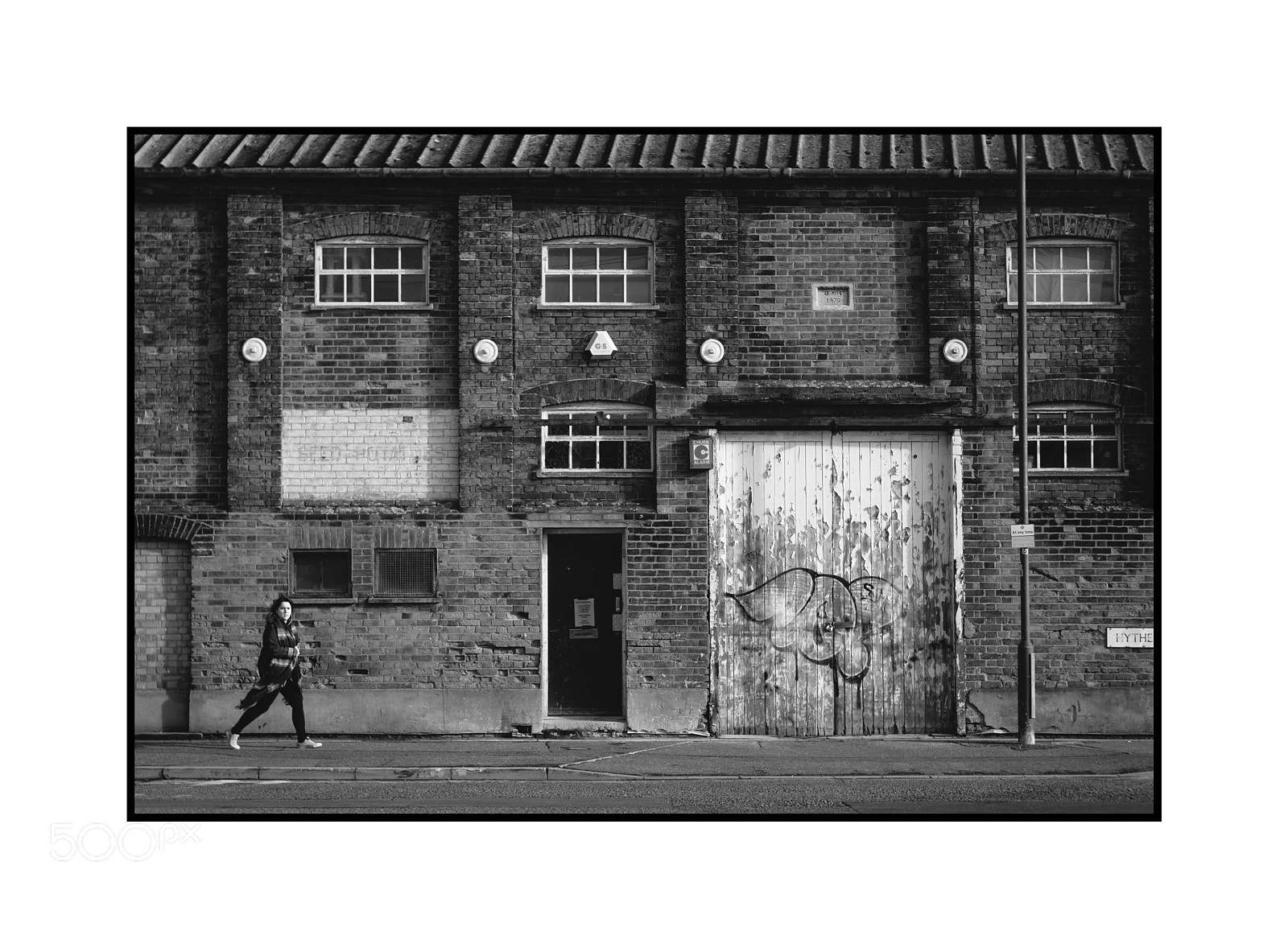 Fujifilm X-T1 sample photo. Walking past the warehouse photography
