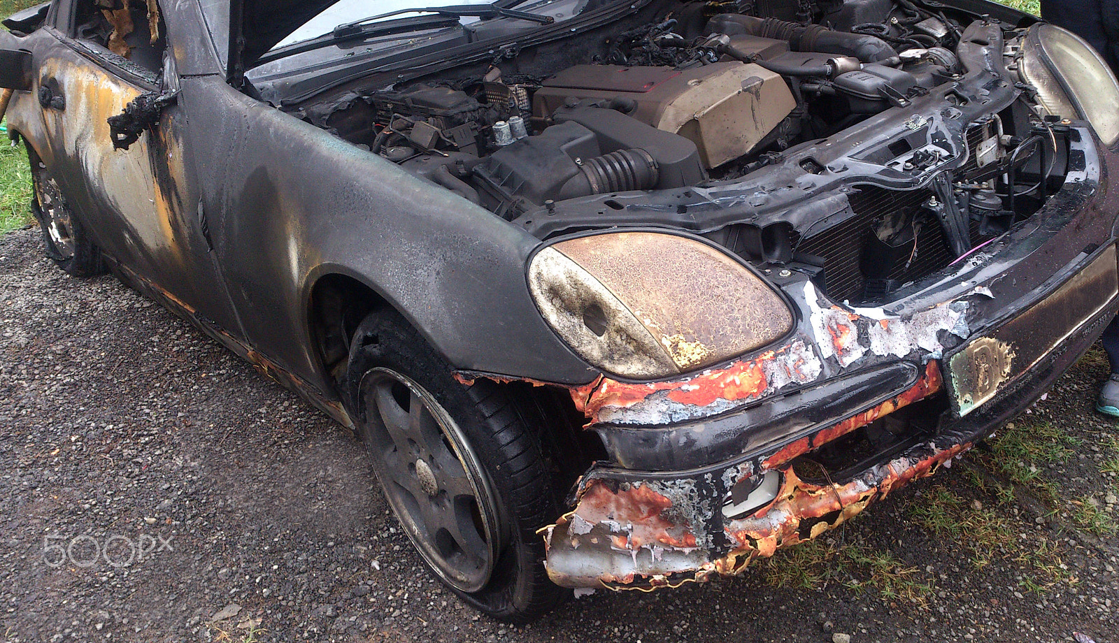 Sony Ericsson Xperia S sample photo. Burned luxury car photography