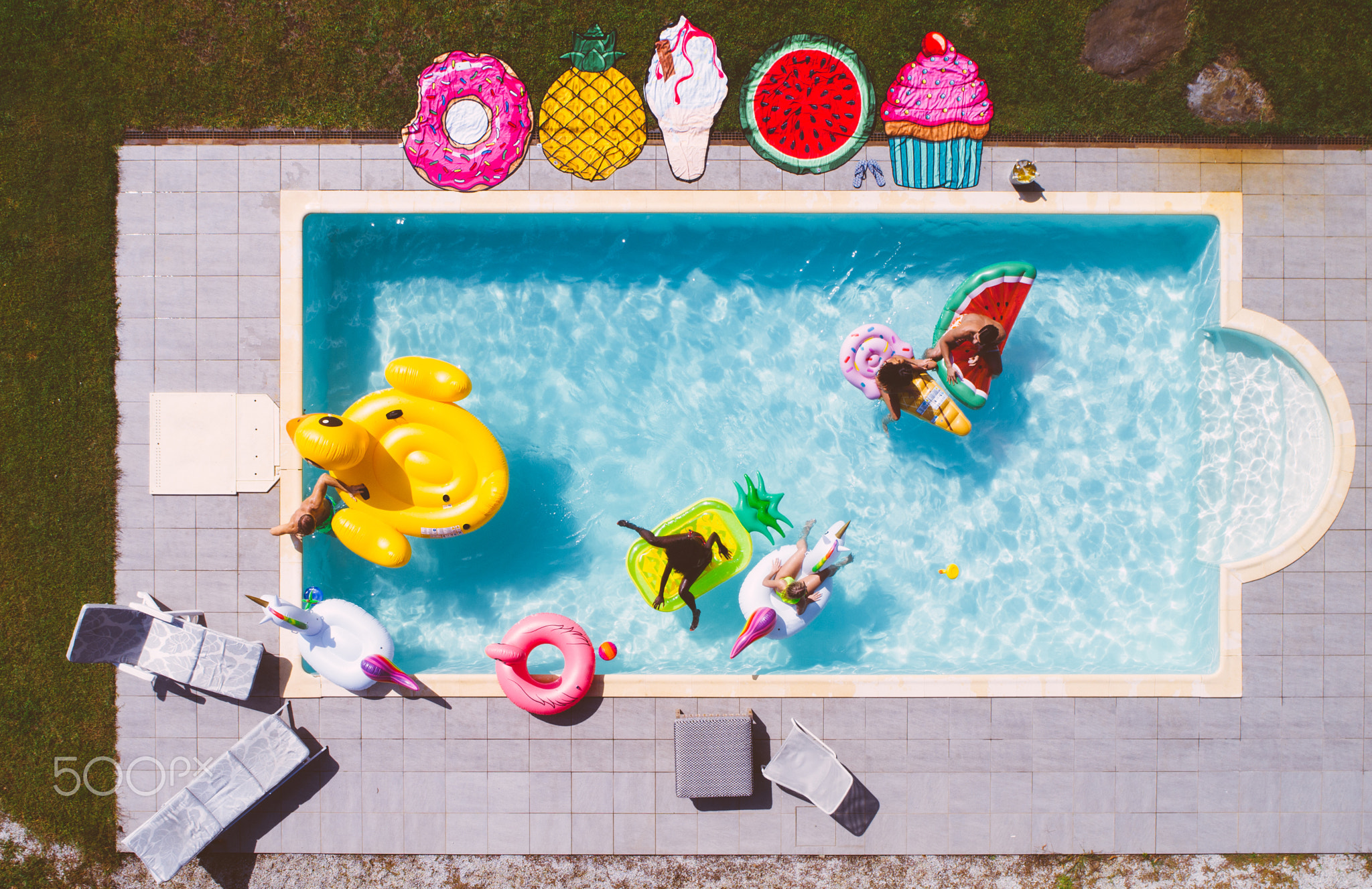group of friends having fun in the swimming pool