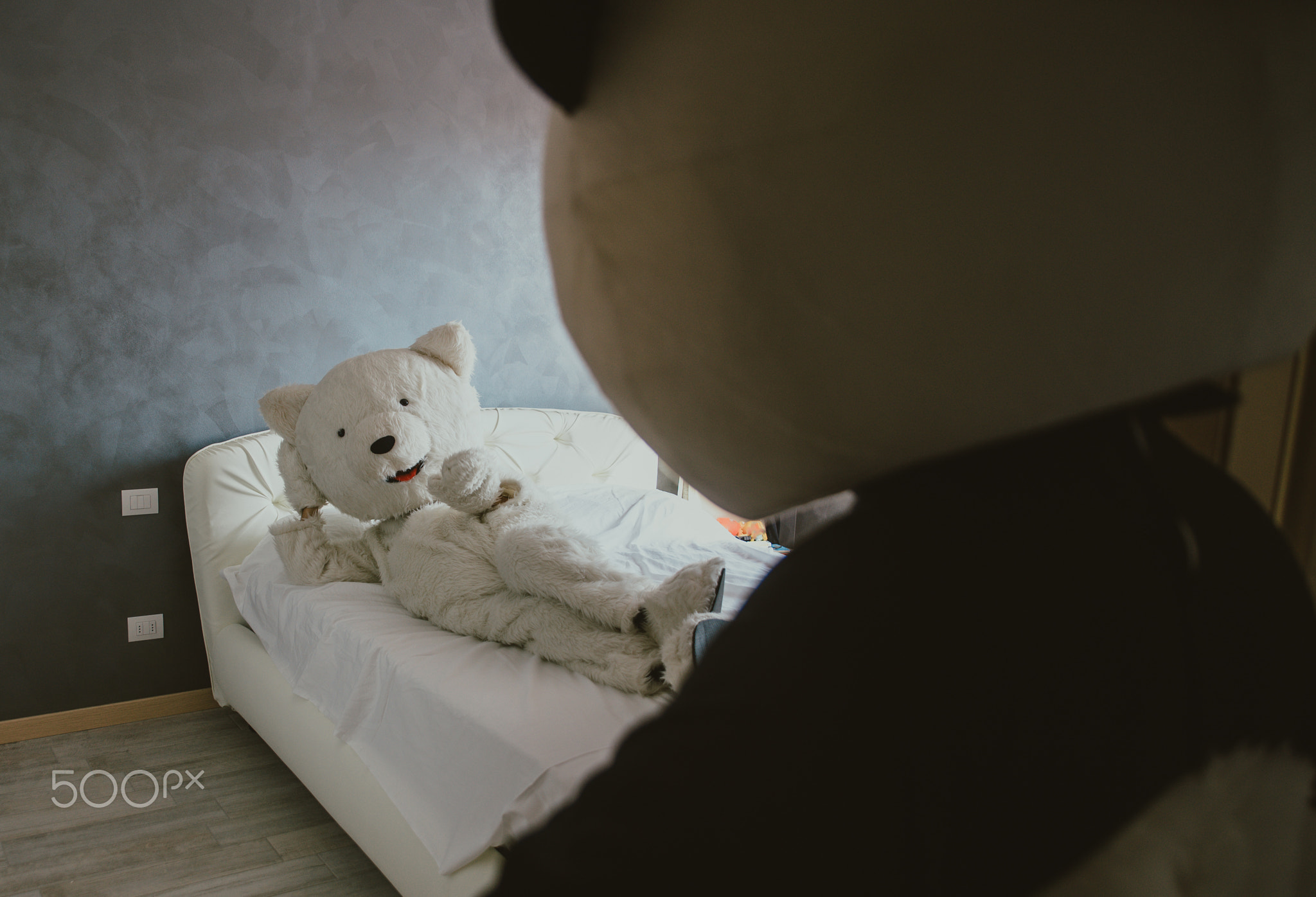 Men with animal costumes spending time inside the house