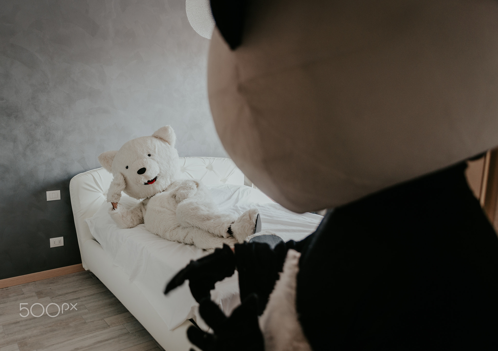 Men with animal costumes spending time inside the house