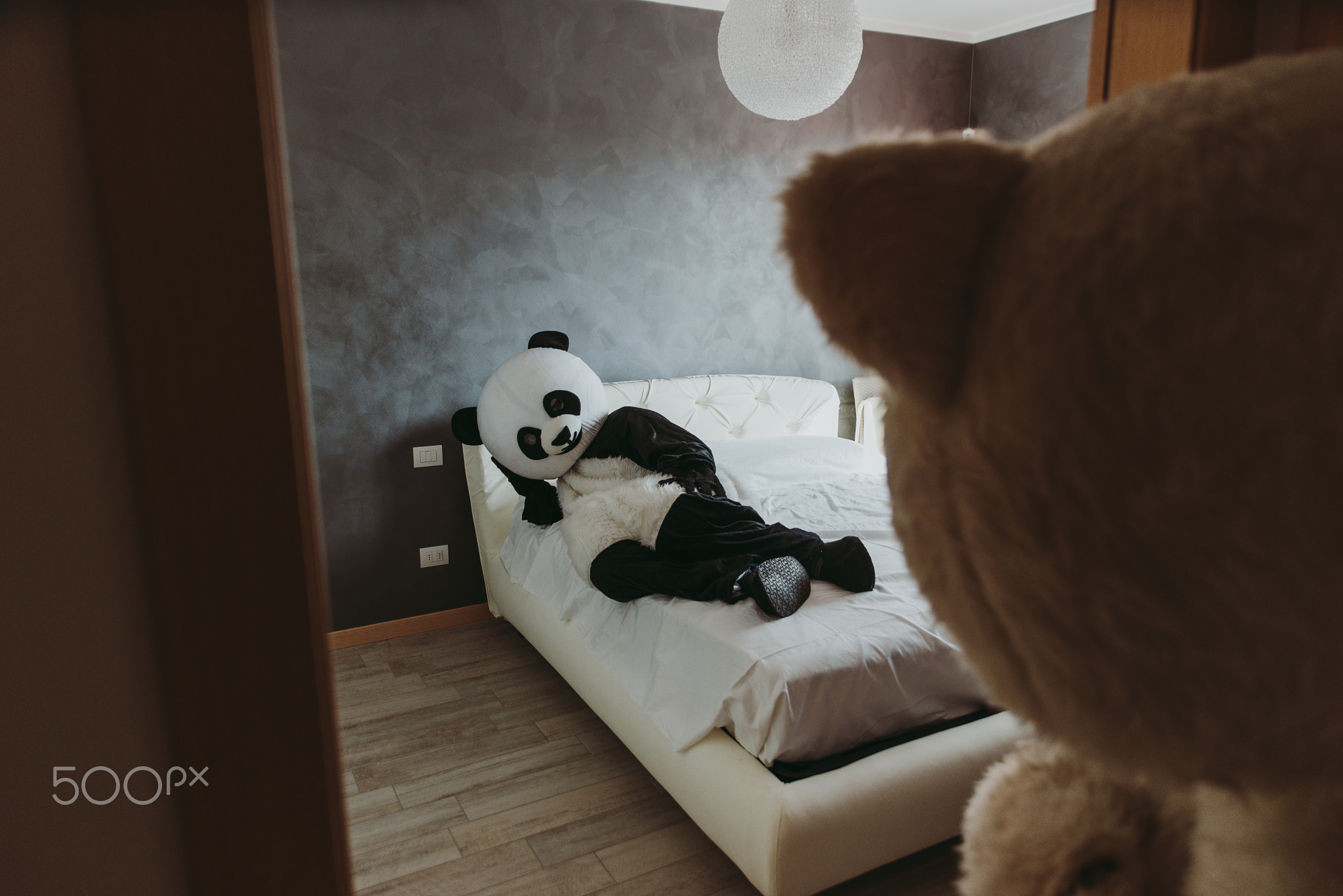 Men with animal costumes spending time inside the house