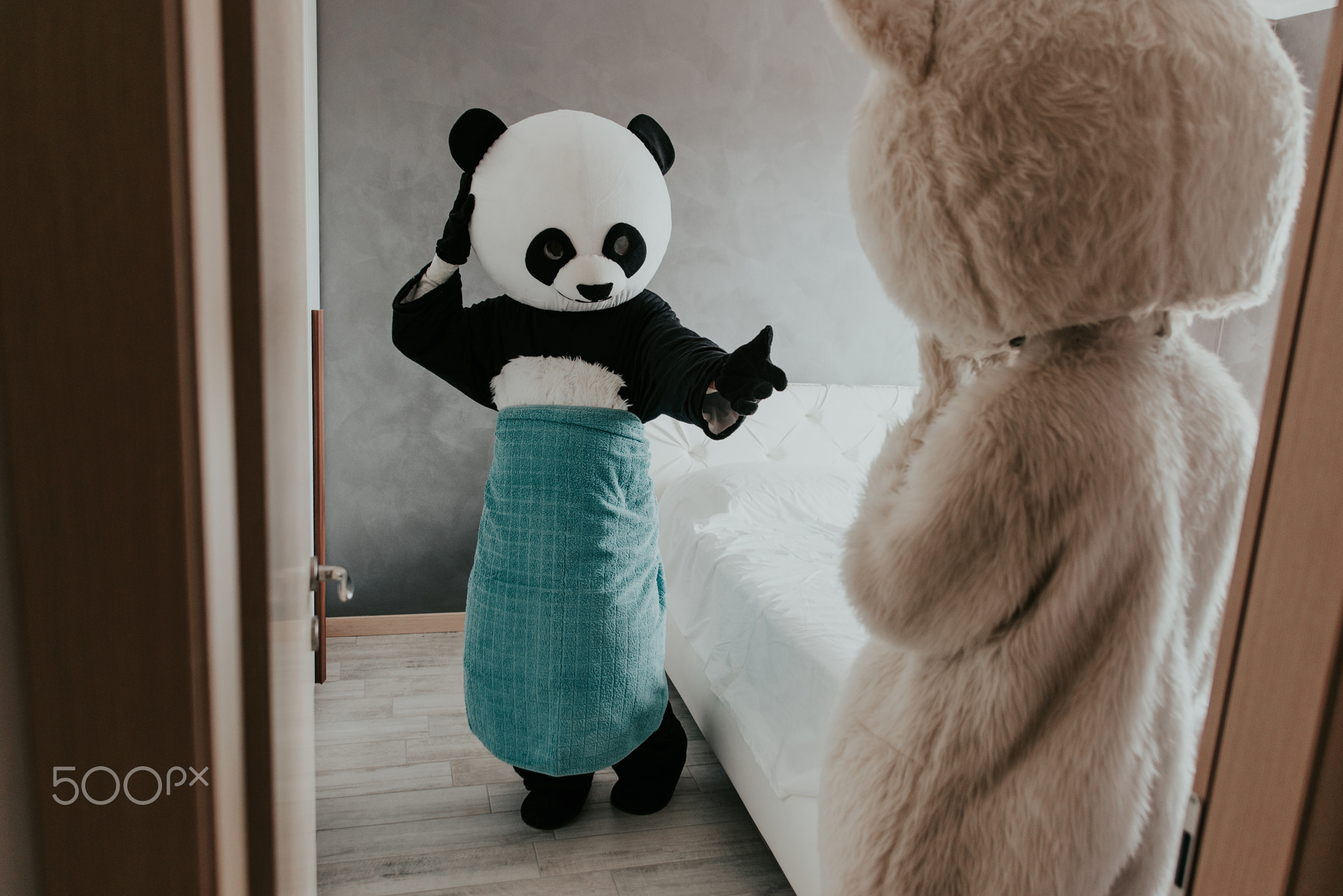 Men with animal costumes spending time inside the house