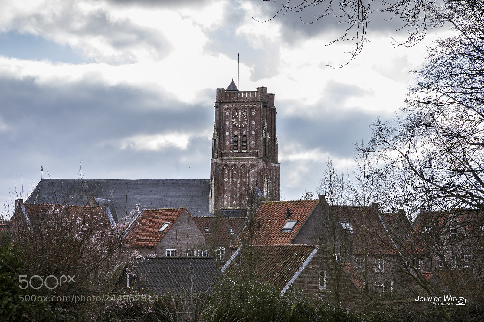 Canon EOS 6D Mark II sample photo. Rooftops and dutch clouds. photography