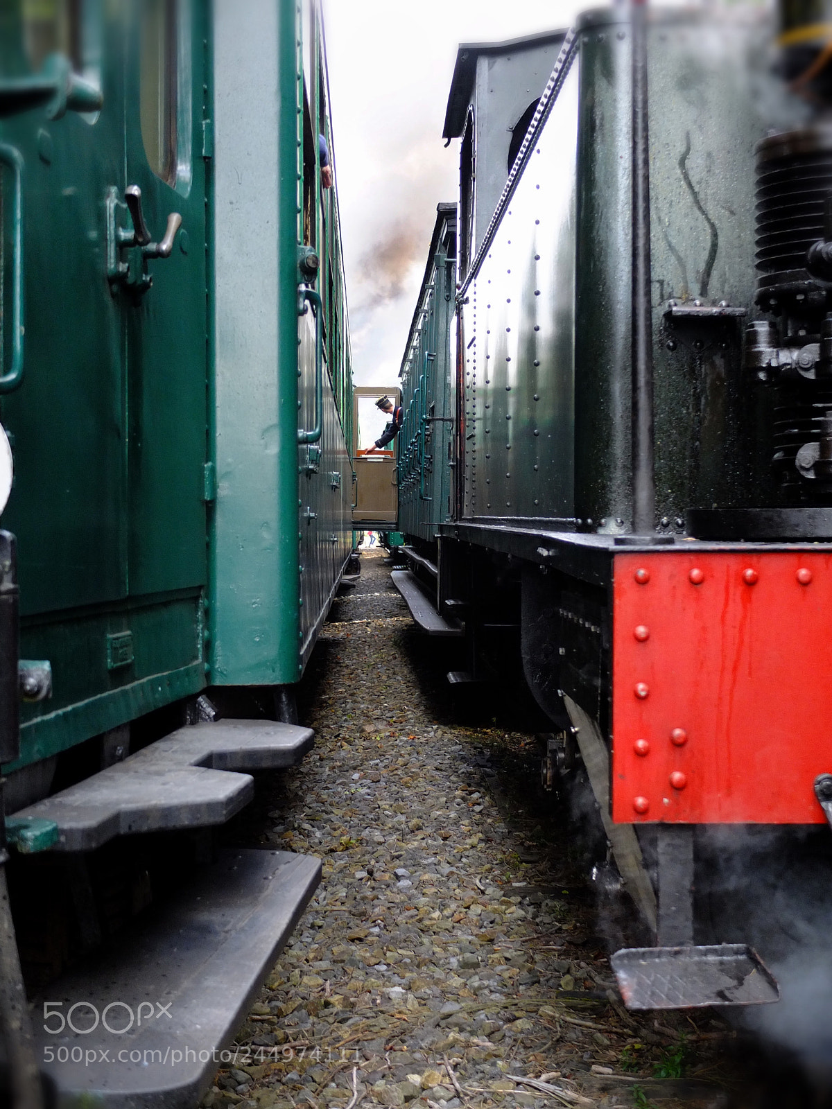 Fujifilm X10 sample photo. Train conductor photography