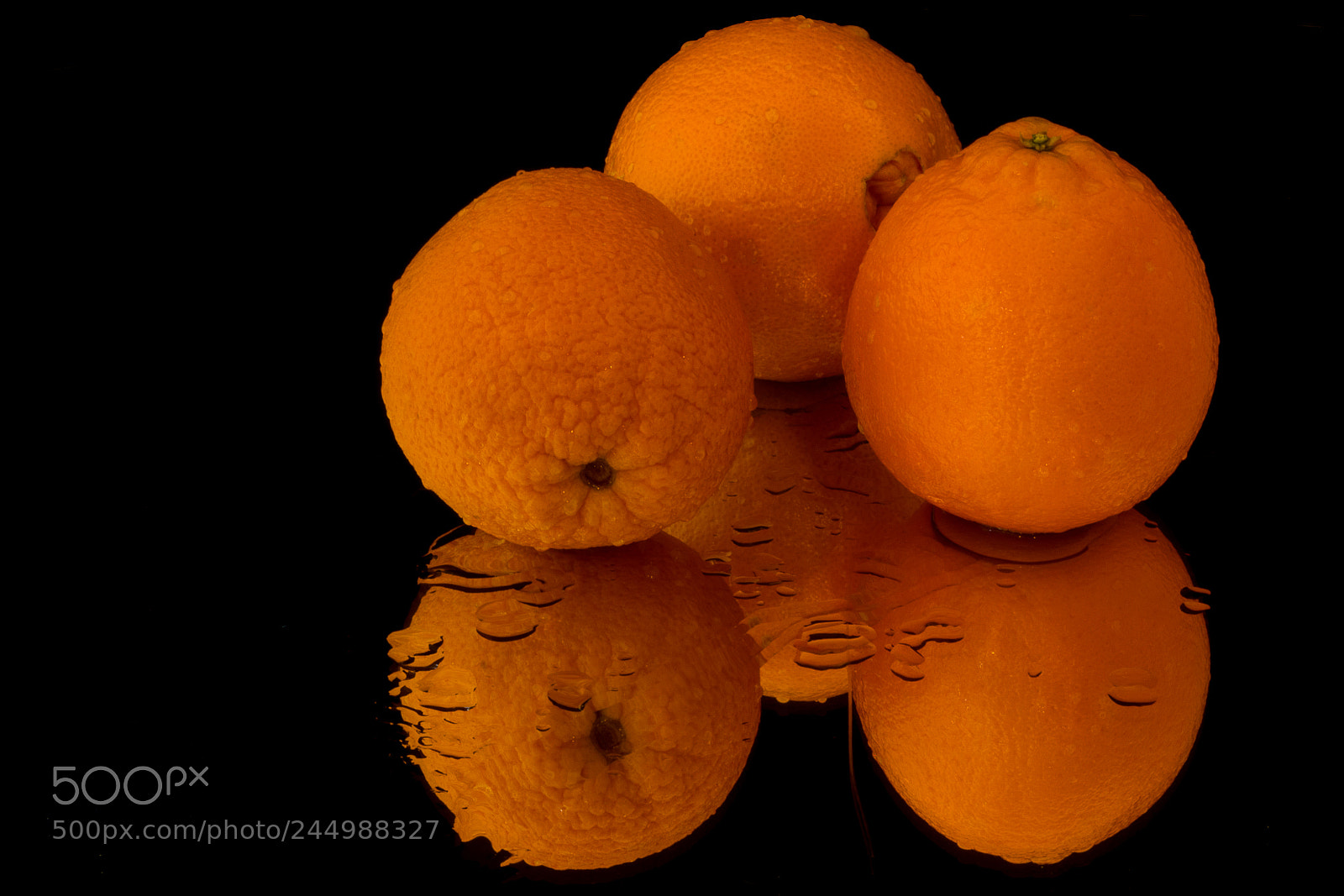 Canon EOS 7D Mark II sample photo. Three oranges on black photography