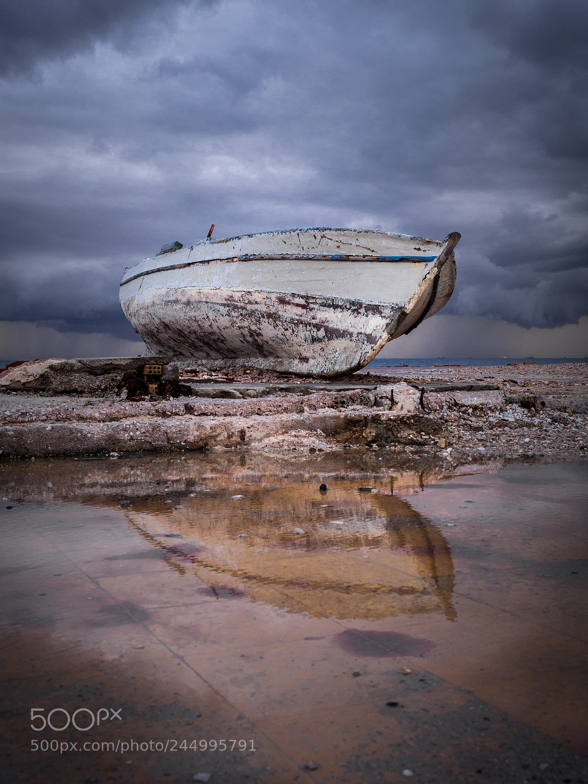 Olympus OM-D E-M10 sample photo. Lonely boat reflection photography