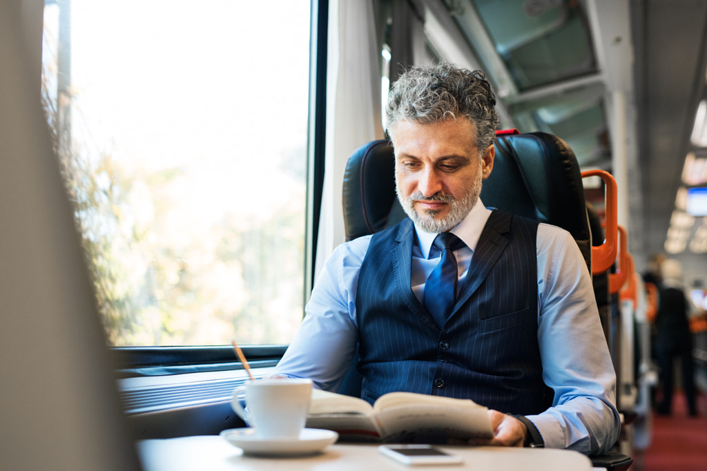 Mature businessman travelling by train. by Jozef Polc on 500px.com