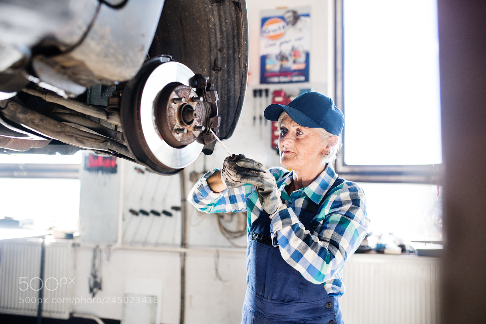 Nikon D5 sample photo. Senior female mechanic repairing photography