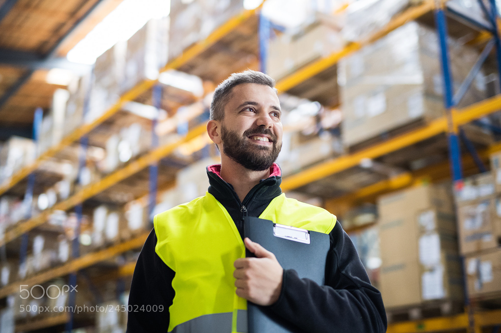 Nikon D5 sample photo. Male warehouse worker with photography