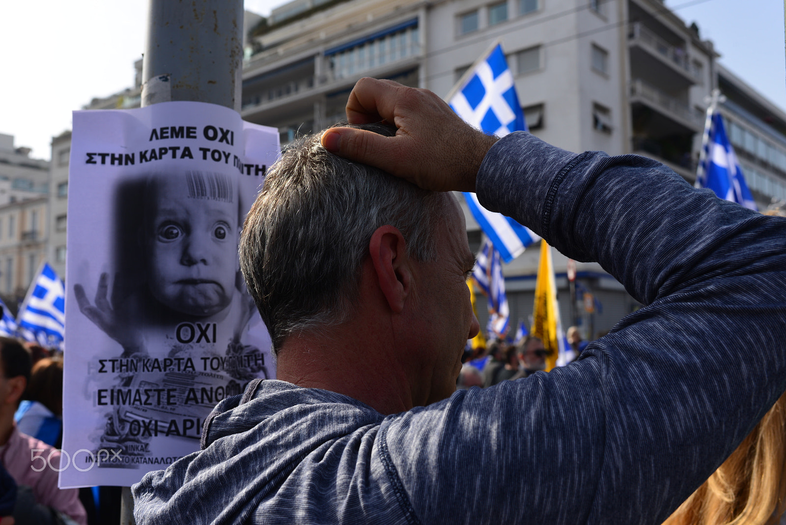 Nikon D610 + Nikon AF-S Nikkor 35mm F1.4G sample photo. "an angry baby" at the protest rally in athens photography