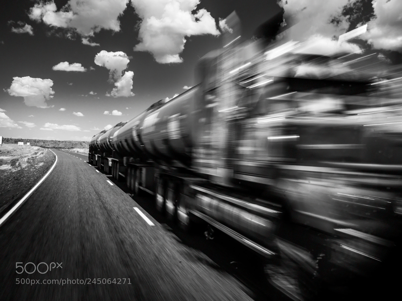 Olympus OM-D E-M5 sample photo. Australian road train crossing photography