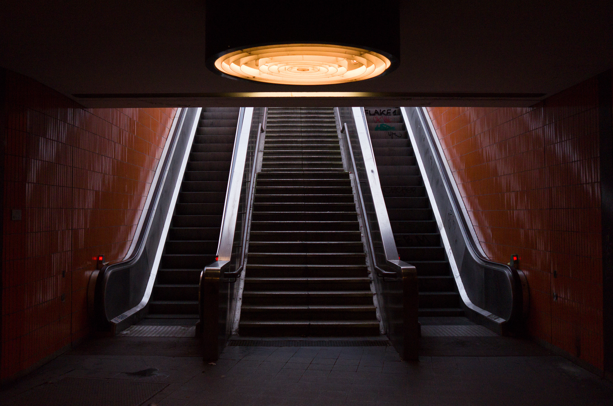 Leica X-E (TYP 102) sample photo. Orange silver escalator photography