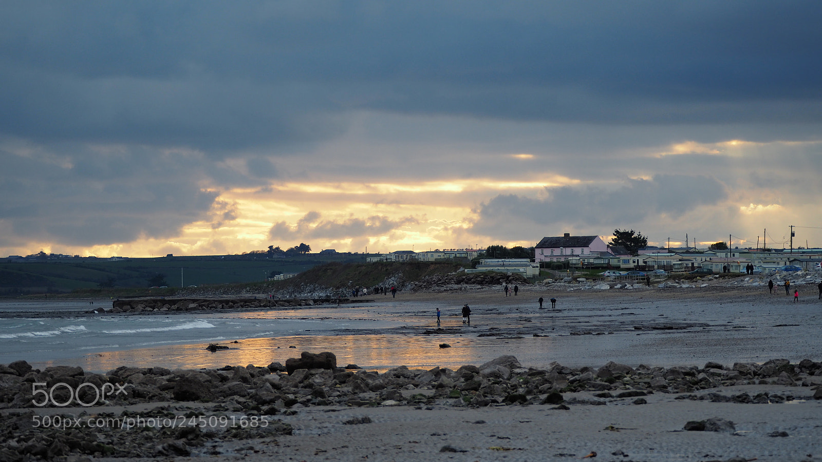 Olympus OM-D E-M5 II sample photo. Sun setting beyond garryvoe photography