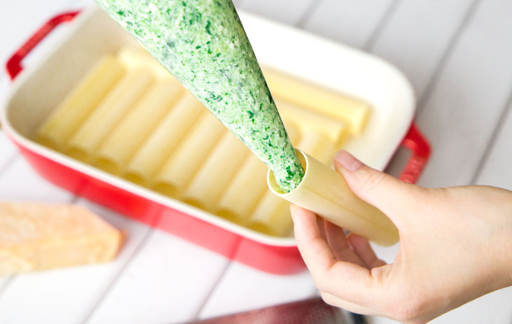 Spinach and cheese cannelloni preparation : Stuffing the cannelloni with the spinach and cheese... by Arina Komarova on 500px.com