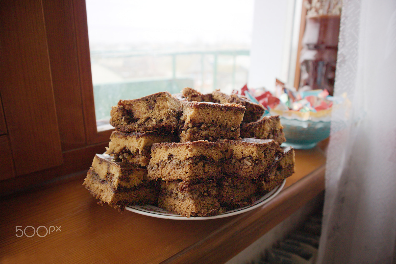 Canon EOS M10 sample photo. Сhocolate cookies on the windowsill in the morning photography