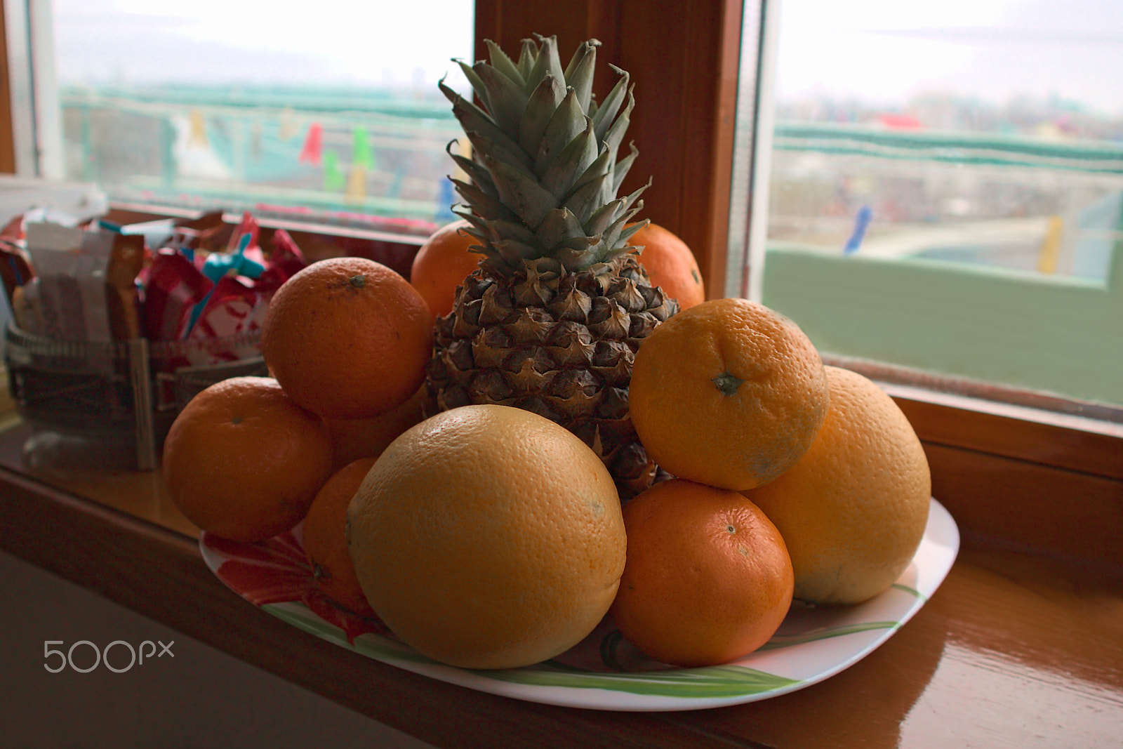 Canon EOS M10 sample photo. Tropical fruits on the windowsill in the morning photography