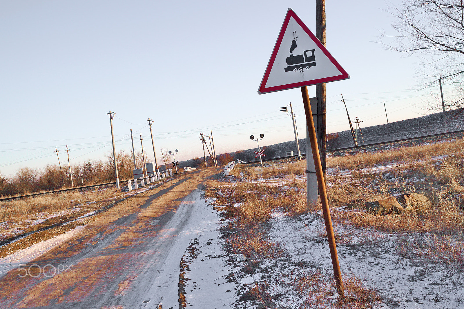 Canon EOS M10 sample photo. Railway crossing at sunset against the backdrop of photography