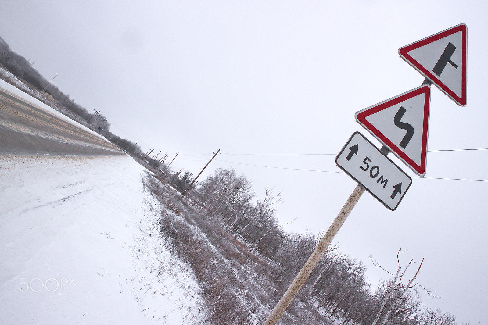 Canon EOS M10 sample photo. Road sign on a highway in winter photography