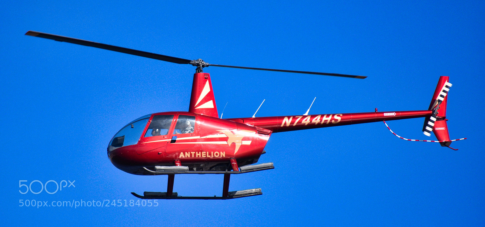 Nikon D7200 sample photo. Red helicopter flying across photography