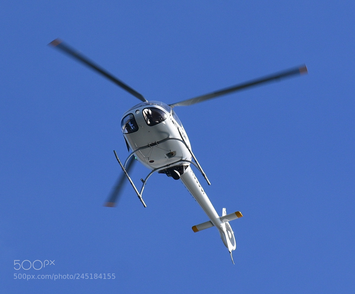 Nikon D7200 sample photo. White helicopter flying across photography
