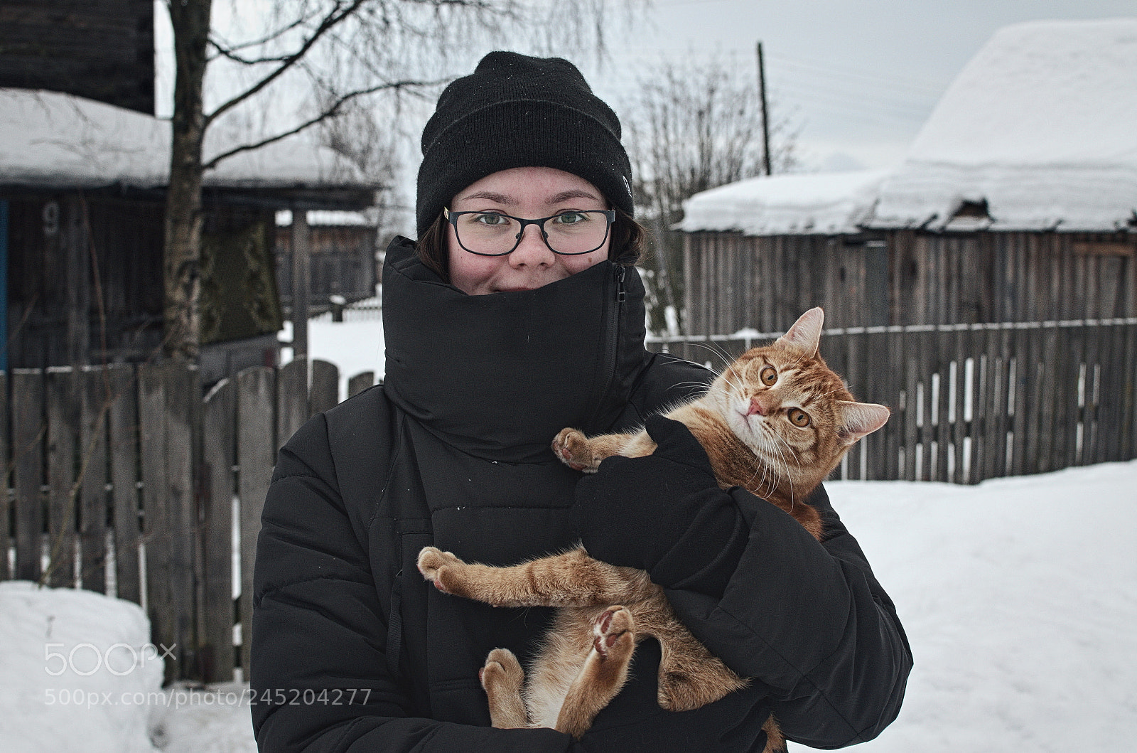 Nikon D5100 + Nikon AF-S DX Nikkor 35mm F1.8G sample photo. Holding a cat photography