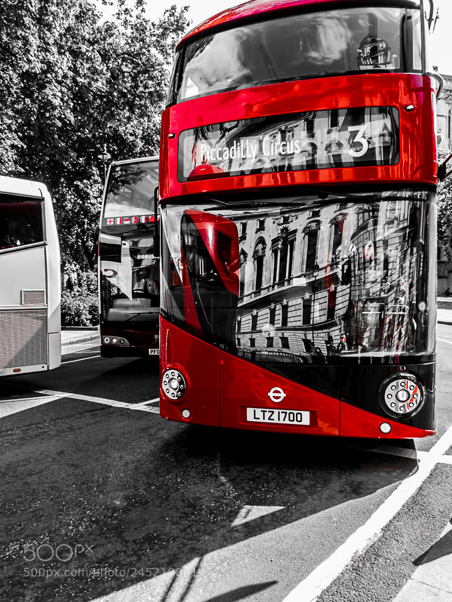 Panasonic Lumix DMC-FZ200 sample photo. Modern red bus in photography