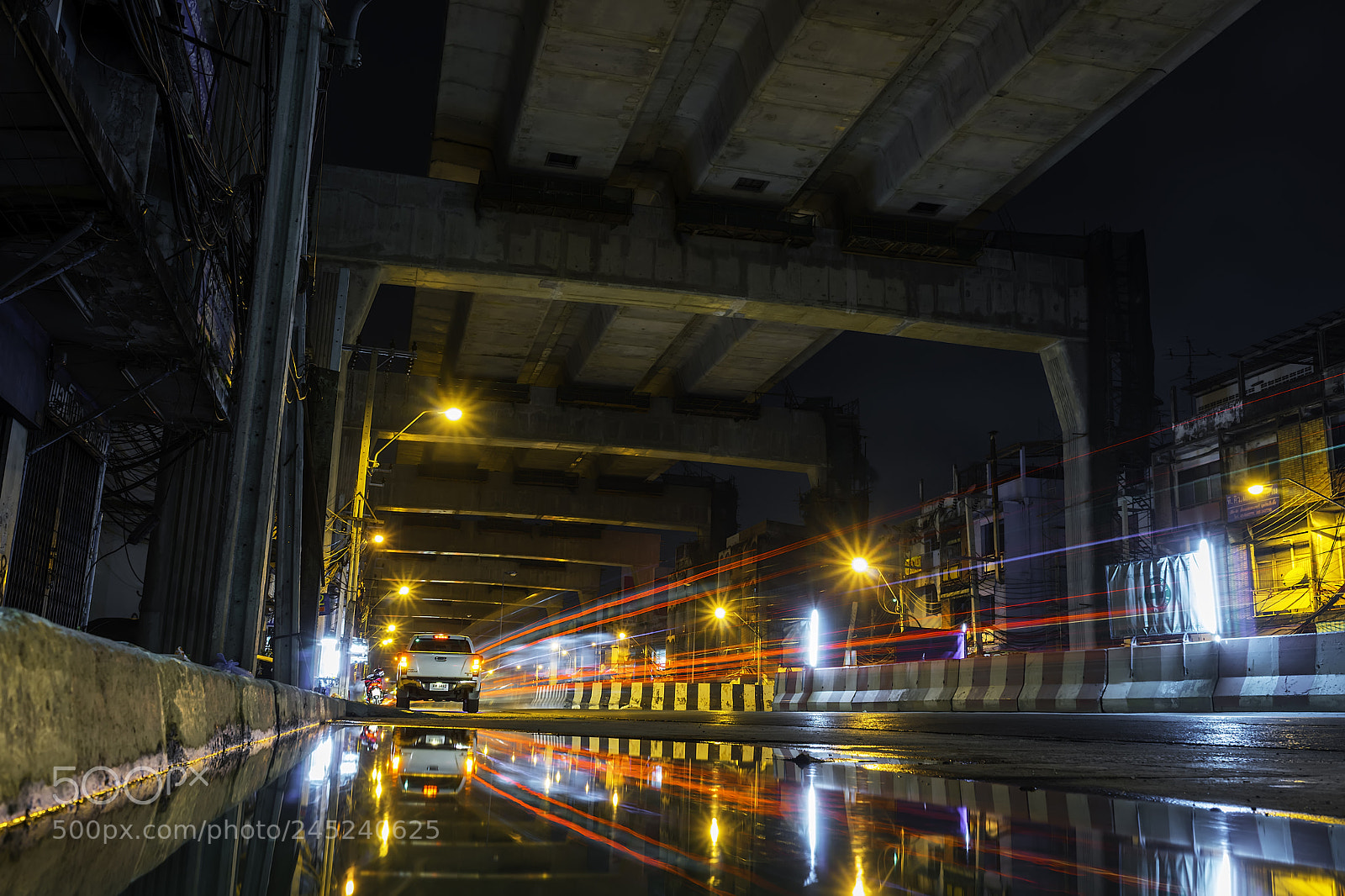 Sony a7 sample photo. Bangkok lights and puddle photography