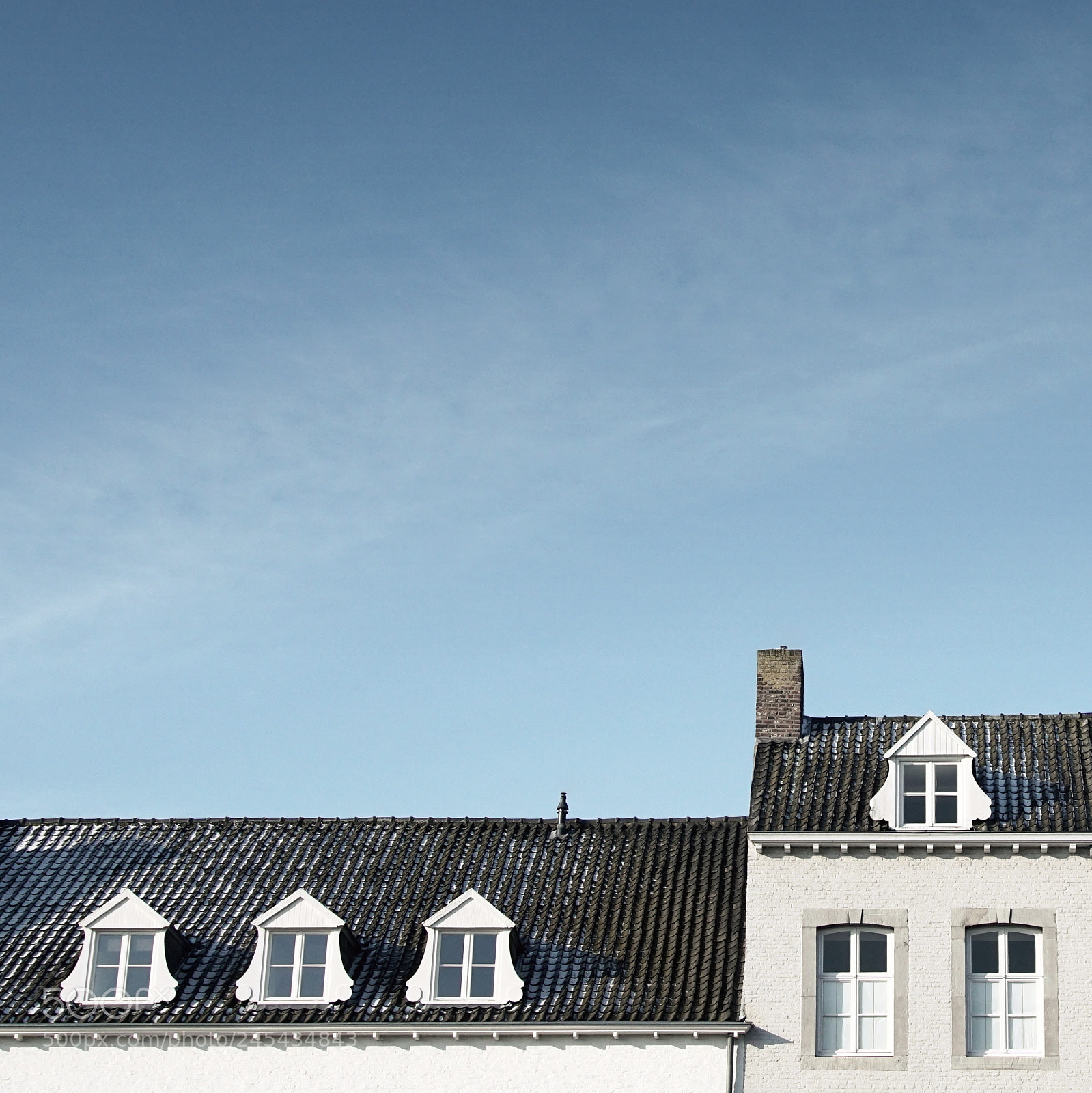 Sony ILCA-77M2 sample photo. Rooftops & blue sky photography