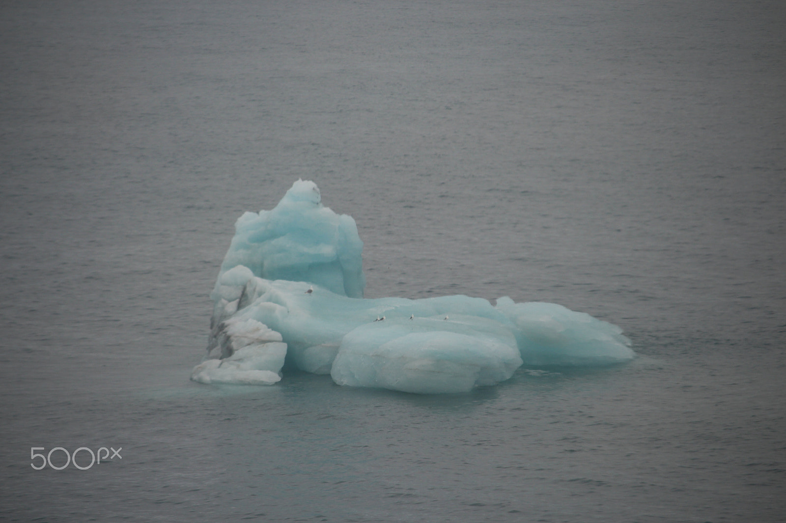 Canon EF-S 55-250mm F4-5.6 IS STM sample photo. Small iceberg floating photography