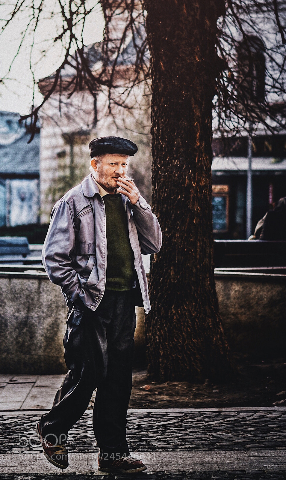 Apple iPhone sample photo. Old man smoking a photography
