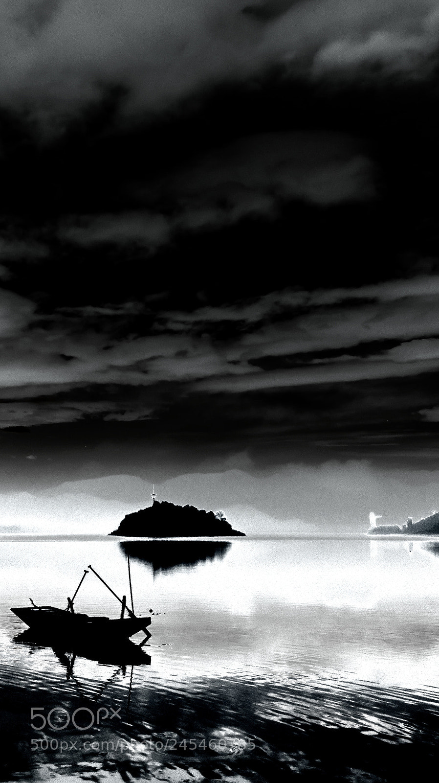Canon PowerShot SX60 HS sample photo. Boat under thick clouds photography