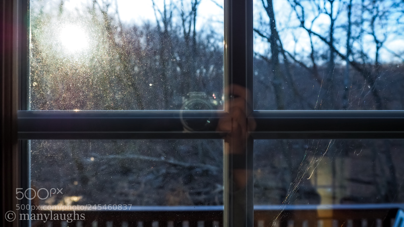 Olympus OM-D E-M10 III sample photo. Camera reflected in window photography