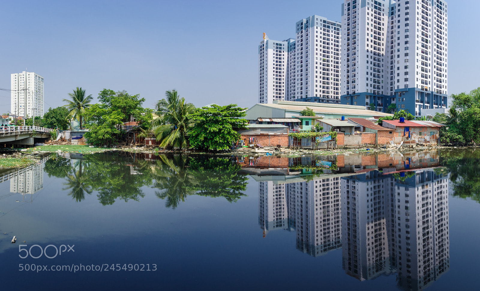 Pentax K-3 sample photo. Slums and modern apartments photography