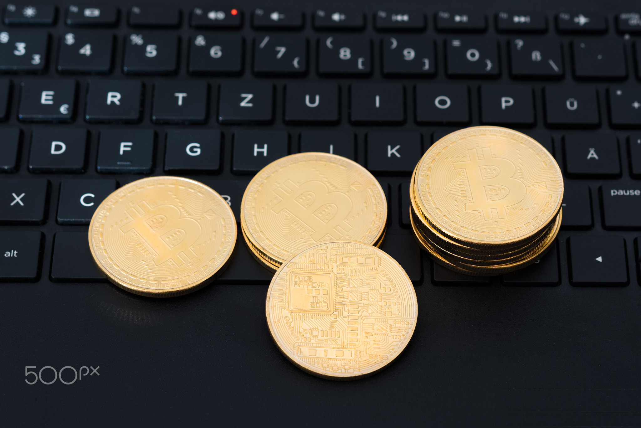 bitcoins on keyboard