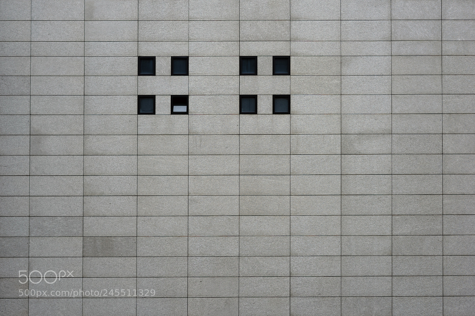 Sony a7 II sample photo. Modern facade with small photography