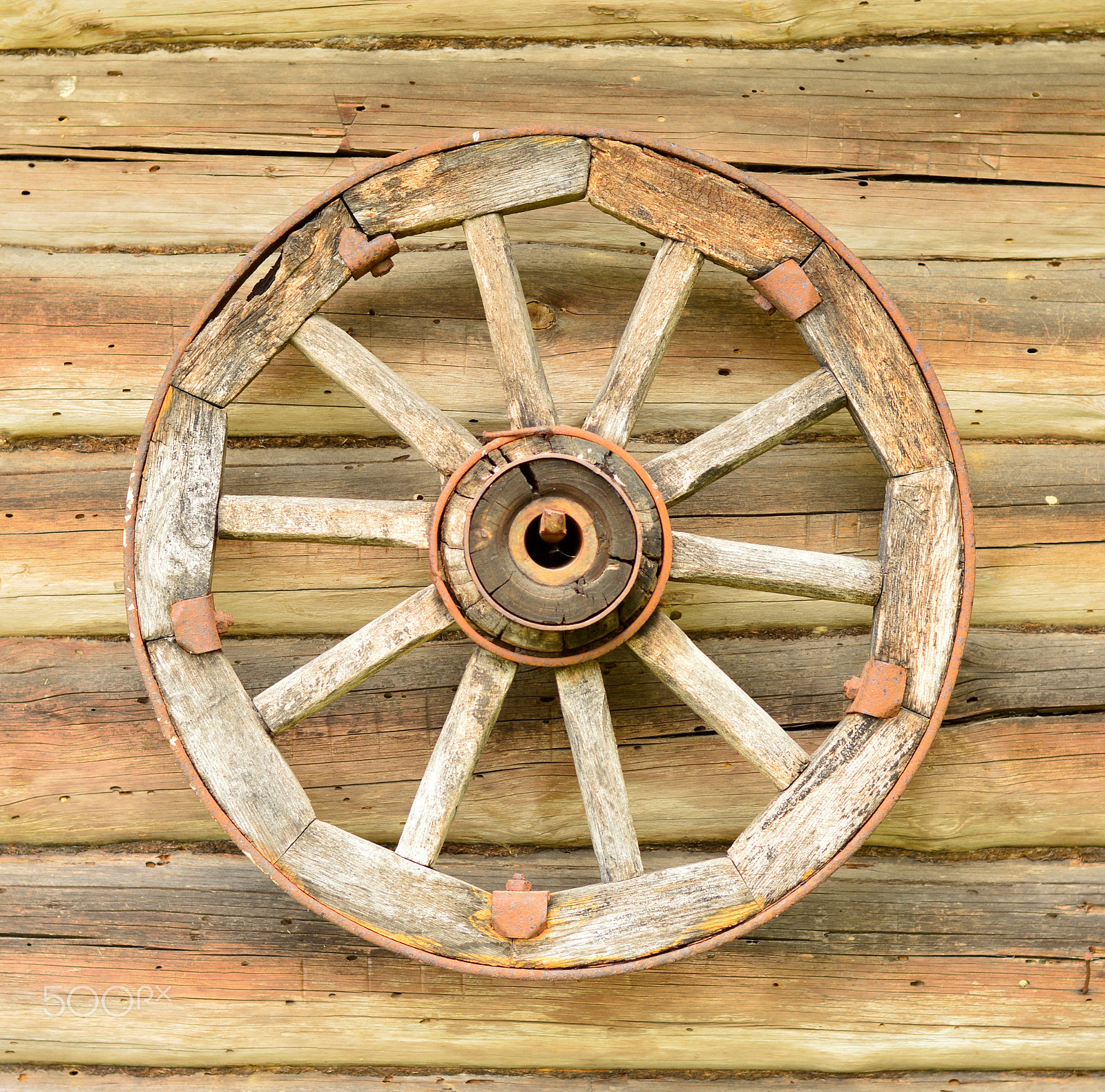 Nikon D3200 + Nikon AF-S Nikkor 50mm F1.8G sample photo. A wheel hanging on a wall photography