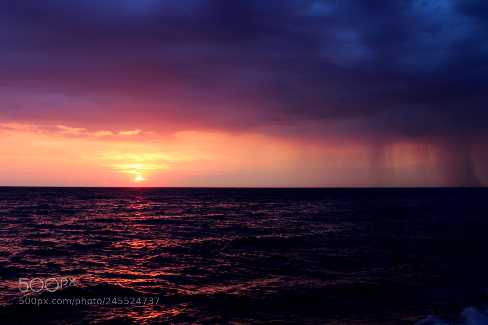 Canon EOS 100D (EOS Rebel SL1 / EOS Kiss X7) sample photo. Rain over the sea photography