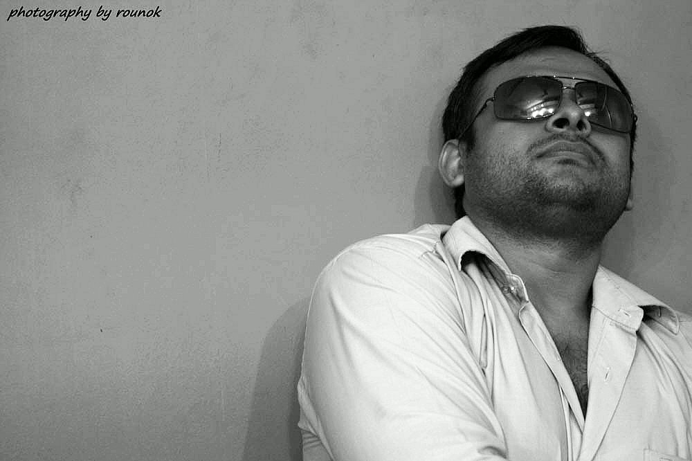 Canon EOS 450D (EOS Rebel XSi / EOS Kiss X2) sample photo. Man in black... photography