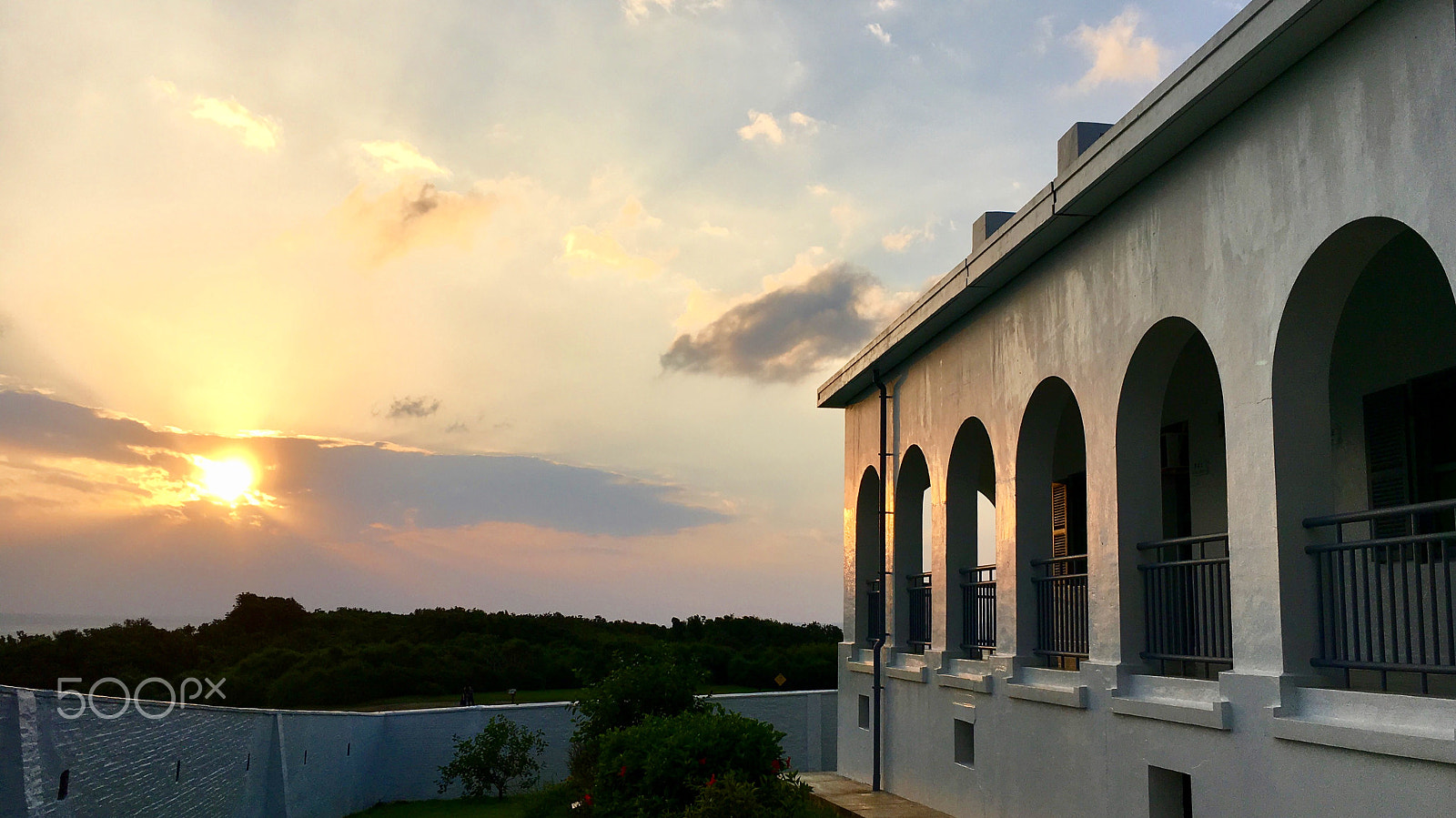 Apple iPhone8,1 sample photo. The sunset and the building with arched doors. photography