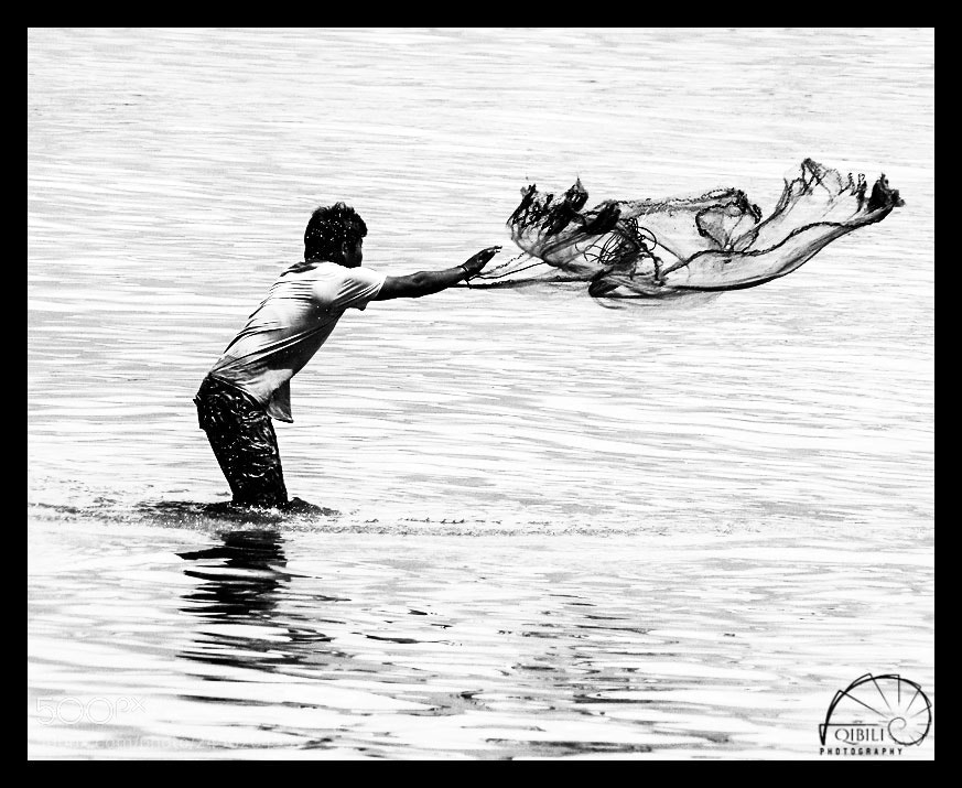 Sony Cyber-shot DSC-HX1 sample photo. Fisherman casting his net photography